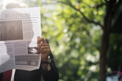 Varian acquires Sirtex - man with newspaper